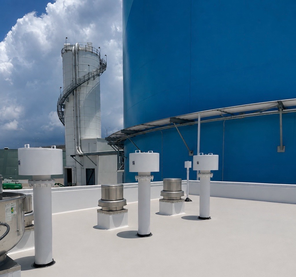 Industrial plant rooftop piping and vent stacks coated in white