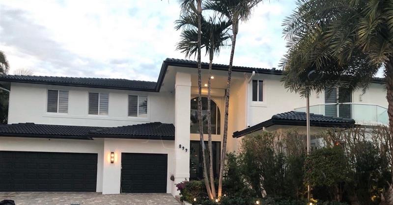 Modern two-story in crisp white with black trim